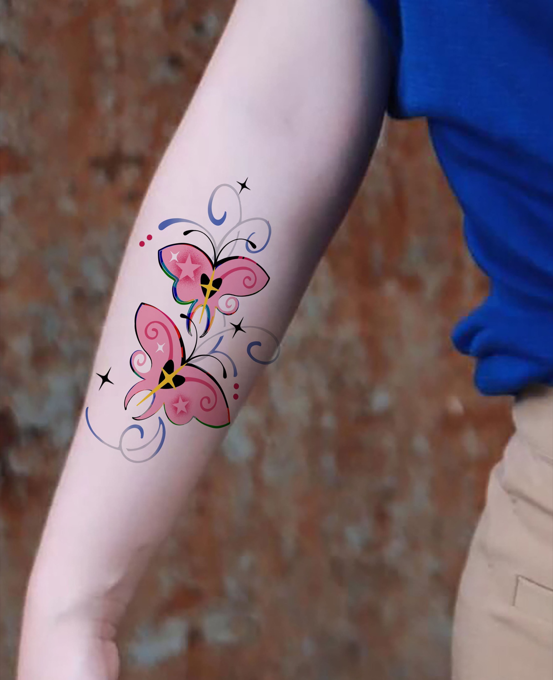 Two pink butterfly tattoos placed on forearm
