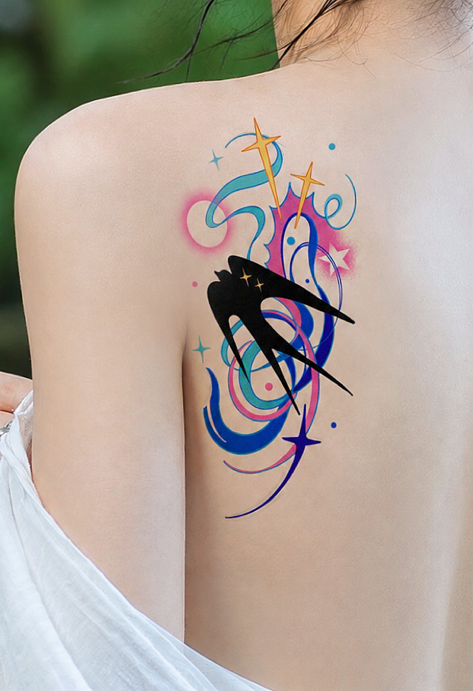 Black bird silhouette tattoo placed on back